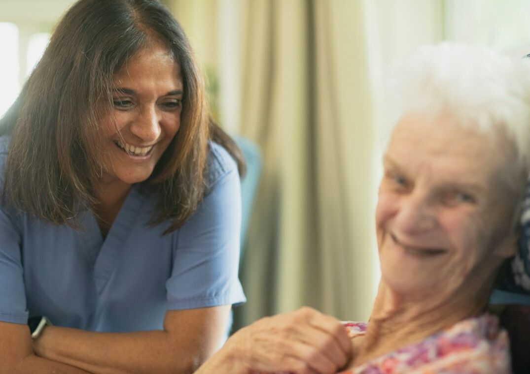 nurse helping elderly patient